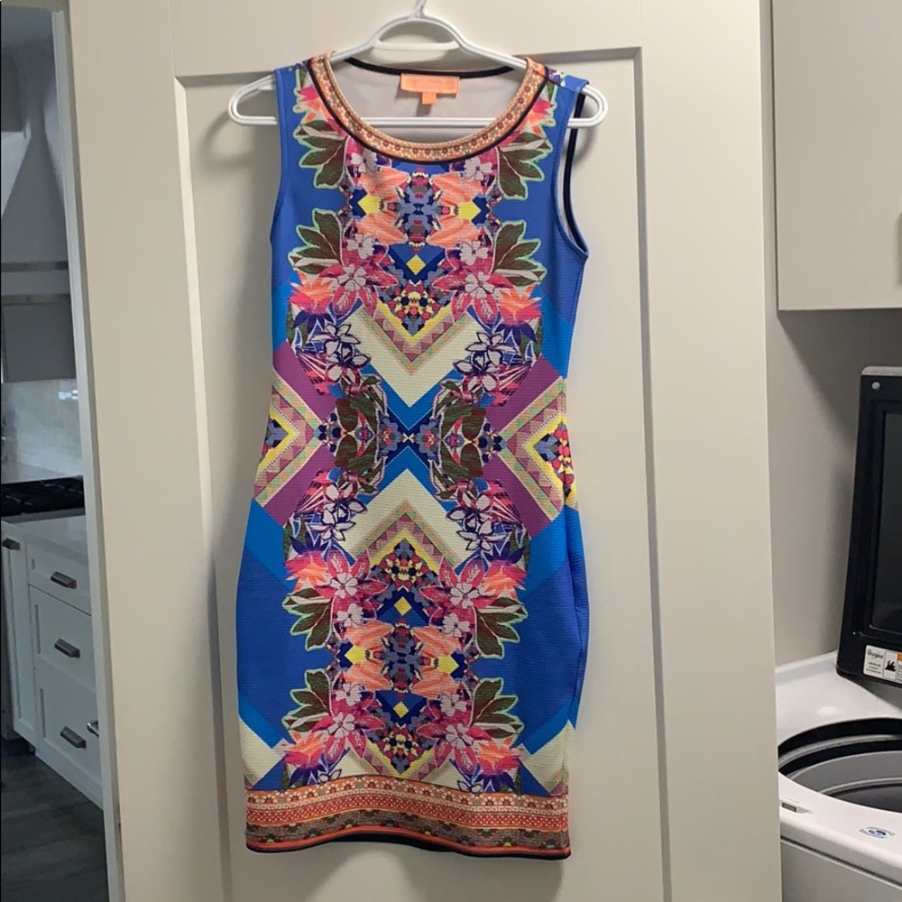 Peachpuff cocktail dress, body hugging.